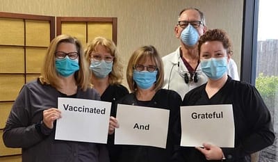 vaccinated staff group photo