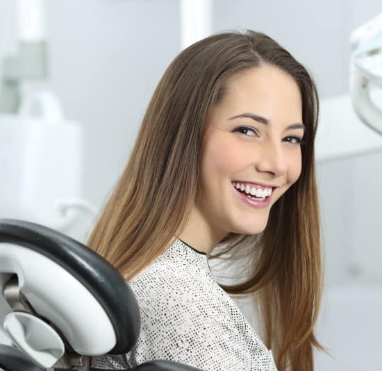 girl smiling dental chair