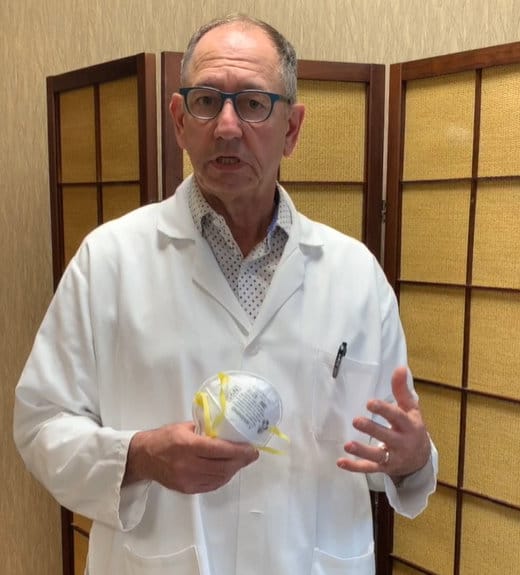 dr otten holding protective mask